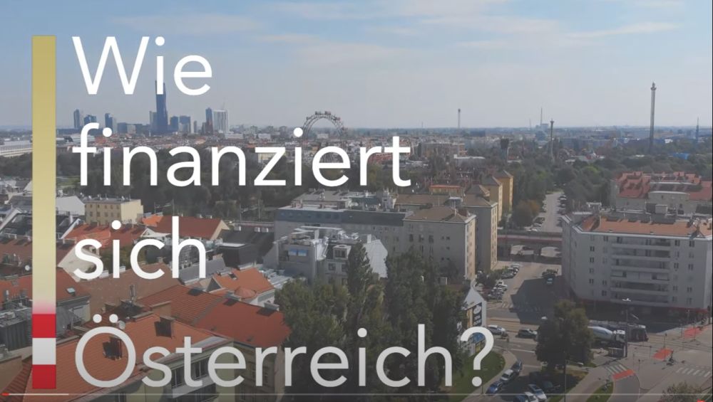 Luftaufnahme Stadt mit der Frage: Wie finanziert sich Österreich?
